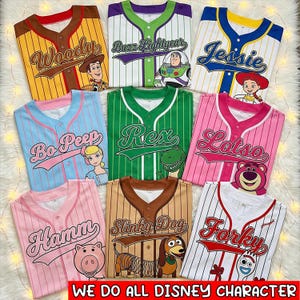 May include: A collection of baseball jerseys featuring Toy Story characters like Woody, Buzz Lightyear, and Jessie. Each jersey displays a character's name and image. The jerseys come in a variety of colours, including yellow, green, pink, and blue. The text at the bottom reads: WE DO ALL DISNEY CHARACTER.