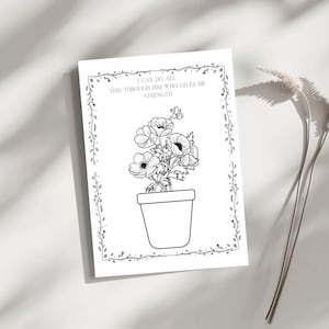 Può includere: Stampa artistica in bianco e nero con una pianta in vaso e la scritta "I CAN DO ALL THIS THROUGH HIM WHO GIVES ME STRENGTH" in una cornice decorativa. La stampa è su sfondo bianco.