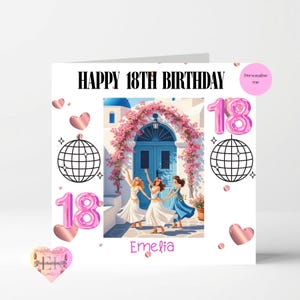 May include: A white birthday card with the text "HAPPY 18TH BIRTHDAY" in black. The card features an illustration of three women dancing in front of a blue door, with pink floral accents and the name "Emelia". Pink number 18 balloons and heart shapes are also included.