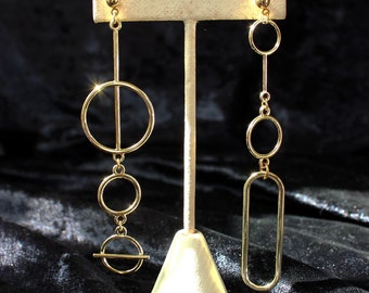 Mismatched statement earrings, modern geometric minimalist gold tone shoulder dusters
