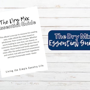 Könnte beinhalten: Ein weißes Papier mit dem Titel "The Dry Mix Essential Guide" und Text, der den Inhalt des eBooks beschreibt. Ein marineblaues Rechteck mit demselben Titel ist ebenfalls vorhanden. Der Hintergrund ist eine weiße Holzoberfläche.