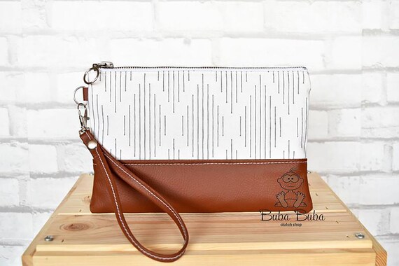 white wristlet clutch bag