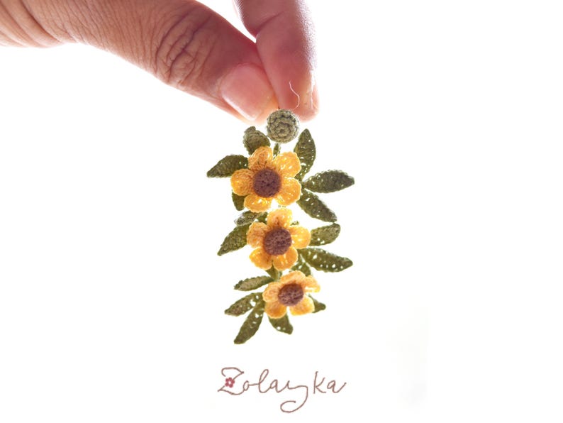 micro crochet buttercup Earrings displayed hanging to show drop length of 5 cm and detailed crochet flower work