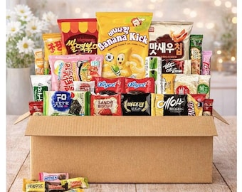 May include: A cardboard box overflowing with a variety of colorful snack packages. The snacks include chips, cookies, and candies, with text in Korean and English. The box is open, revealing the assortment of treats.