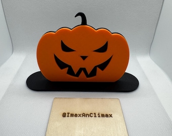 Figura decorativa de calabaza de Halloween: decoración de escritorio, naranja y negro, 5,75 x 3,75 pulgadas.