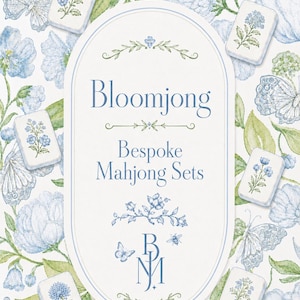 May include: An artistic image featuring a collection of bespoke mahjong sets. The design includes floral and butterfly motifs in shades of blue and green. The text "Bloomjong Bespoke Mahjong Sets" is displayed in an oval frame.
