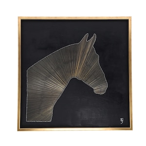 May include: A framed artwork featuring a horse head silhouette crafted with gold-colored string against a black background. The artwork is encased in a gold-colored frame, creating a striking contrast. The horse's profile is detailed with string, and the artist's initials are in the bottom right corner.