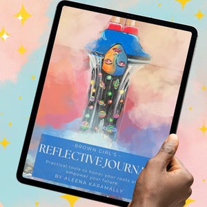 May include: A digital tablet displaying a colorful illustration of a woman with blue hair and a face split into two colors. The tablet also shows the text "BROWN GIRL'S - REFLECTIVE JOURNAL" with additional text below.