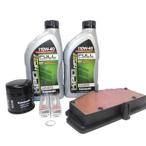 May include: A collection of Kawasaki motorcycle engine maintenance parts. Includes two bottles of 10W-40 full synthetic engine oil, an oil filter, spark plugs, an air filter, and a washer. The bottles have green and white labels.