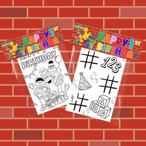 May include: Two Sesame Street-themed coloring pages with a "Happy 1st Birthday" banner. One page features characters and gifts, the other has numbers, symbols, and a party hat. The background is a red brick wall.