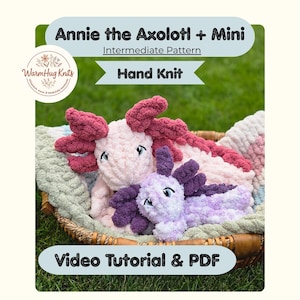 May include: Two hand-knit plush axolotl toys, one large light pink and one smaller light purple, featuring dark purple gills and embroidered eyes. The text reads Annie the Axolotl + Mini, Intermediate Pattern, Hand Knit, and Video Tutorial & PDF.