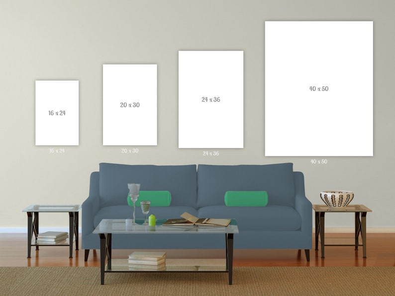 May include: Three white framed canvas prints of different sizes hanging on a light beige wall above a blue sofa. The canvas prints are blank and have the dimensions 16 x 24 inches, 20 x 30 inches, and 40 x 50 inches printed below each canvas.