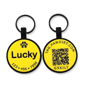 May include: Two yellow and black pet ID tags. One tag has the name "Lucky", a paw print, and a phone number. The other tag has a QR code and the website "TAG.PAWDIET.COM" and the code "G5XJLT".