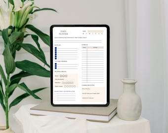 May include: A digital daily planner displayed on a tablet. The planner features sections for to-do lists, priorities, wellness checks, and a schedule. The tablet is on a stack of books, with a white vase and greenery in the background.