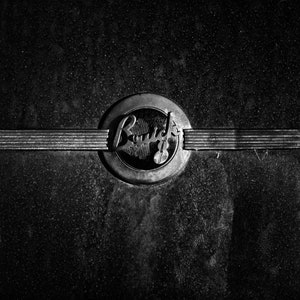 Buick art print in black and white of a buick 8 emblem from a antique buick car perfect for man cave or garage art
