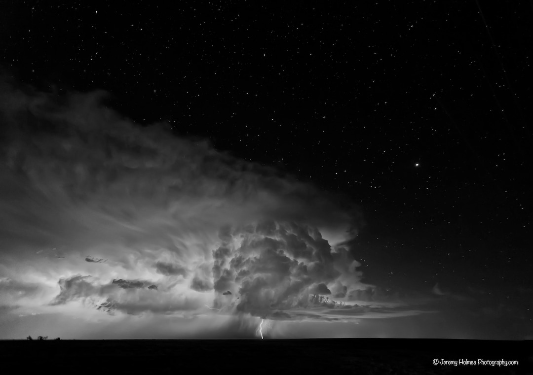 Supercell Thunderstorm With Lightning Bolt and Stars in the Sky Shot in ...