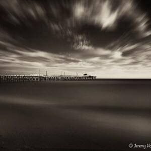 Ocean pier at sunset black and white sepia fine art photography print taken in Florida