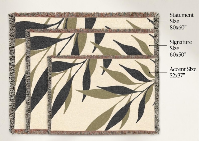 Olive green woven cotton throw blanket size guide showing three options: 52x37 accent size, 60x50 signature size, and 80x60 statement size with botanical branch design.