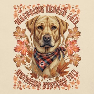 May include: A golden Labrador Retriever wearing a plaid bandana, surrounded by autumn leaves. The image includes the text "WATCHING LEAVES FALL" and "WATCHING SYSTEMS FALL" in a circular design, evoking a fall theme.