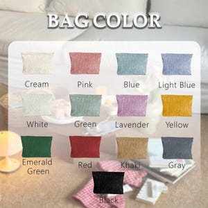 May include: A color chart titled BAG COLOR displaying thirteen rectangular pouches in various shades: cream, pink, blue, light blue, white, green, lavender, yellow, emerald green, red, khaki, gray, and black, each labeled with its respective color name.