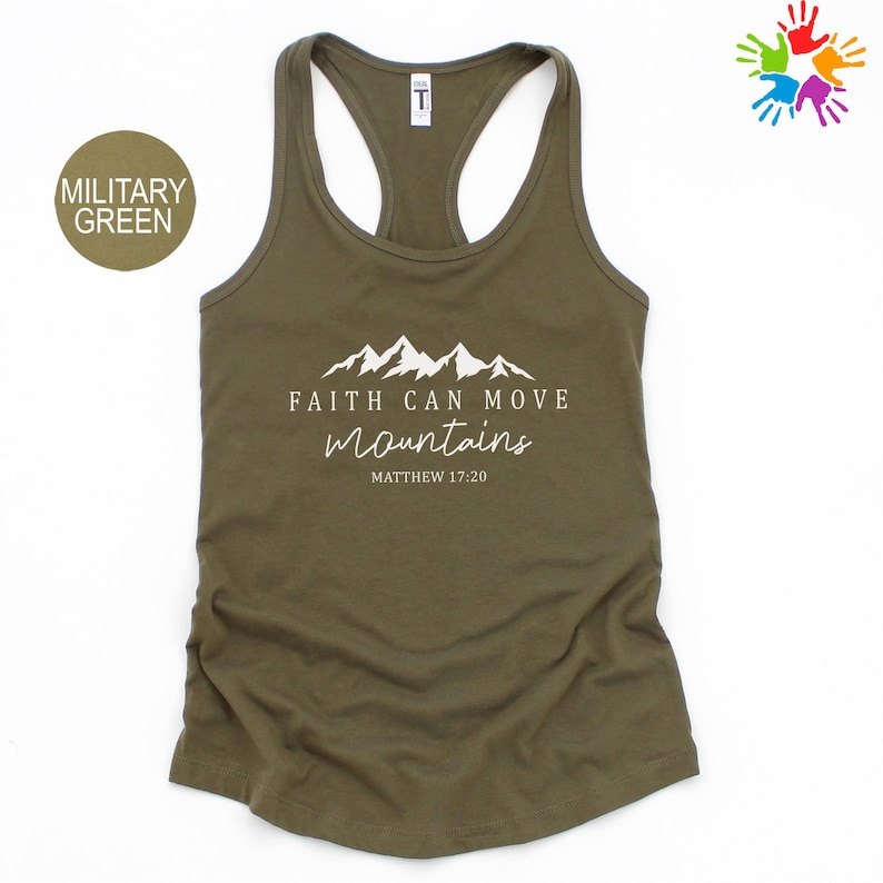 A military green tank top with a printed design of mountains and the text "Faith can move mountains" printed on it.