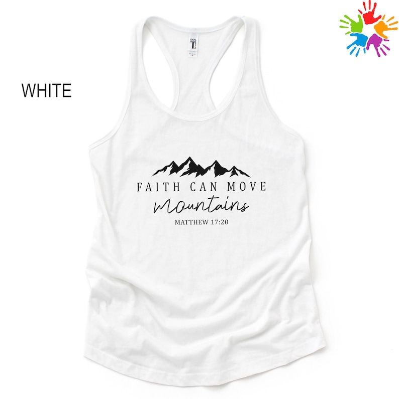 A white tank top with a graphic design featuring mountains and the text "Faith can move mountains" along with a Bible verse reference.