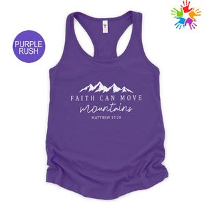 Purple tank top with a mountain range graphic and the text "Faith can move mountains" printed on it.