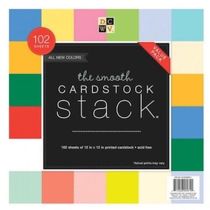 May include: A stack of 102 sheets of 12 x 12 inch printed cardstock in various colors. The cardstock is acid-free and features the text "the smooth CARDSTOCK stack." A red circle indicates "102 sheets." The package includes a "VALUE PACK" label.