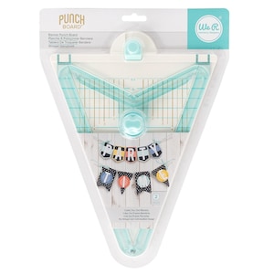 May include: A white and teal plastic banner punch board by We R Memory Keepers in its original packaging. The tool features a triangular shape with a grid, a central punch mechanism, and a top alignment guide. The packaging displays a banner example.