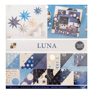 May include: A collection of craft supplies with a celestial theme. Includes star-shaped decorations, a scrapbook page with moon and star accents, and a paper stack with various blue and gold foil designs. The paper stack is 12 x 12 inches.