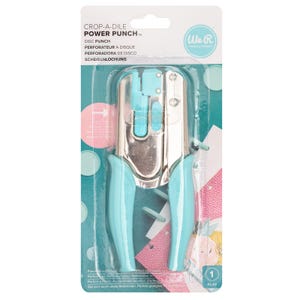 May include: A teal and silver Crop-A-Dile Power Punch disc punch tool in its original packaging. The packaging includes the product name, the brand logo, and the product's features. The tool has teal handles and a silver punch mechanism.