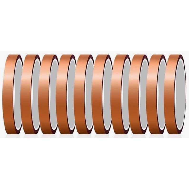 May include: A collection of copper-colored tape rolls, arranged vertically. Each roll has a metallic sheen and a white interior. The tape appears to be of a thin, flexible material, suitable for various crafting or decorative purposes.