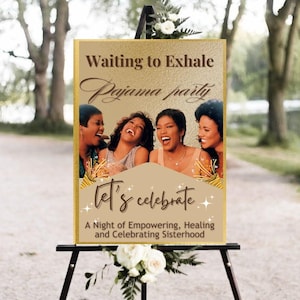 May include: A sign on a black easel with the text "Waiting to Exhale Pajama party" and "Let's celebrate". The sign features a photo of four women laughing. The bottom of the sign reads "A Night of Empowering, Healing and Celebrating Sisterhood."
