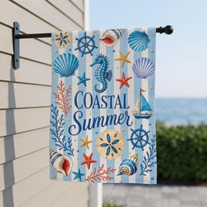 May include: A vertical garden flag featuring light blue and white vertical stripes with a pattern of seashells, starfish, a seahorse, a sailboat, and ship wheels. The text Coastal Summer is printed in the center in a dark blue script font.