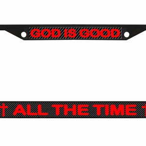 May include: Black license plate frame with the text "GOD IS GOOD" at the top and "ALL THE TIME" at the bottom in red letters. The text is on a black and gray striped background.