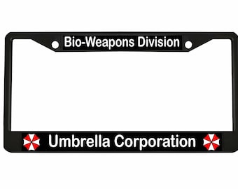May include: Black license plate frame with the text "Bio-Weapons Division" at the top and "Umbrella Corporation" at the bottom. The Umbrella Corporation logo is on each side of the bottom text.