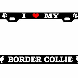 May include: Black license plate frame with white text and graphics. The top reads "I ❤️ MY" with a red heart. The bottom reads "BORDER COLLIE" with a silhouette of a Border Collie dog on each side. Paw prints and bones decorate the corners.