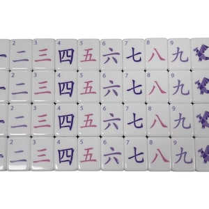 May include: A set of white Mahjong tiles arranged in rows. Each tile features a number from one to nine in both Arabic numerals and Chinese characters, along with a purple dragon symbol. The numbers are in purple and pink.