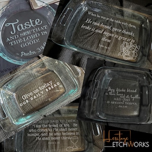 May include: A collection of clear glass baking dishes and a pie plate, each etched with religious quotes and imagery. The pie plate features the text "Taste and see that the Lord is good!" and the baking dishes have various Bible verses.