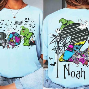 May include: A light blue t-shirt featuring The Nightmare Before Christmas characters. The front displays the text Birthday BOY with spiderwebs, bats, and characters. The back shows a large number 2 with the name Noah and various movie characters.