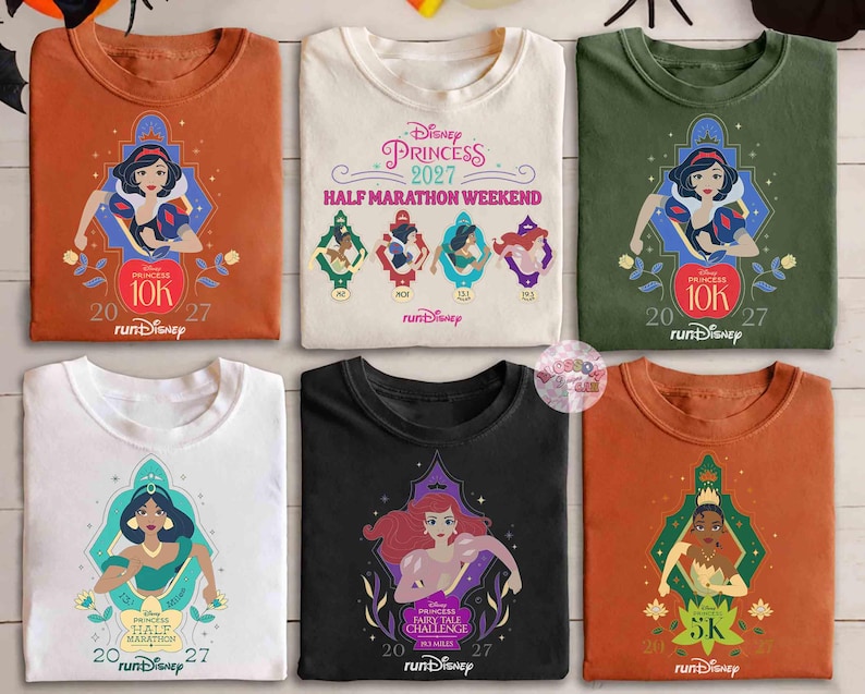 May include: A collection of six t-shirts featuring Disney Princesses. Each shirt has a different princess graphic, including Snow White, Jasmine, and Ariel, with event details like "Princess Half Marathon Weekend" and "10K" and "5K" runs. The shirts come in various colors.