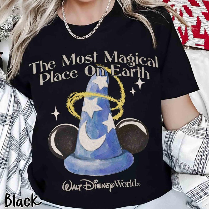 May include: Black t-shirt with the text "The Most Magical Place On Earth" and a blue wizard hat design. The shirt also features the "Walt Disney World" logo and Mickey Mouse ears. A classic design.