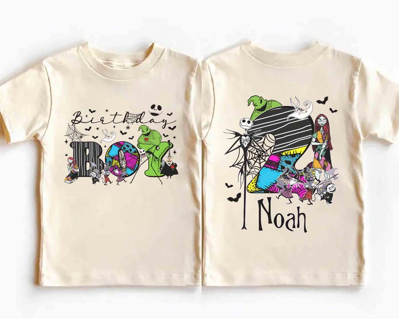 May include: Two cream-colored short-sleeve t-shirts featuring graphic prints inspired by The Nightmare Before Christmas. One shirt displays the text Birthday Boy with characters and spiderwebs. The other shows a large number 2, the name Noah, and characters.