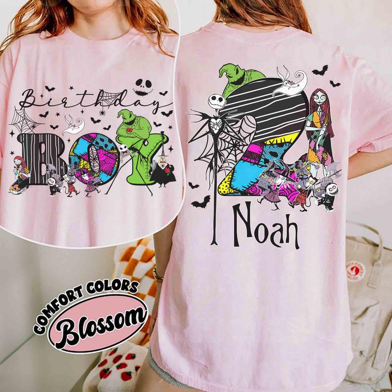 May include: A light pink t-shirt featuring The Nightmare Before Christmas characters. The front displays the text Birthday BOY with Oogie Boogie and Jack Skellington. The back shows a large number 2, the name Noah, and various movie characters.