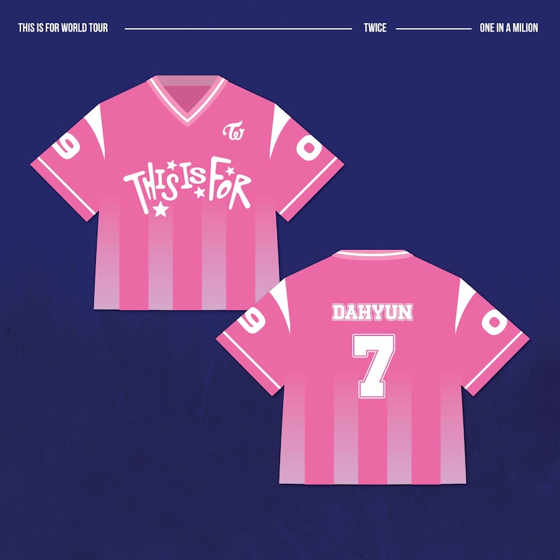 May include: Pink soccer-style jersey with white accents and the text "THIS IS FOR" in a stylized font. The back of the jersey displays "DAHYUN" and the number "7". The jersey has vertical stripes and is set against a dark blue background.