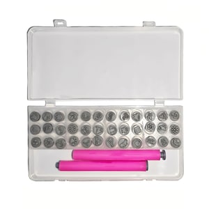 May include: A clear plastic case containing a set of small, grey metal stamps with various nature-themed designs, including flowers, leaves, and animals. Two bright pink handles are also included, likely for use with the stamps.