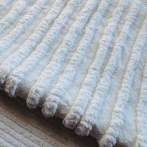 Crisp white fluffy tufts straight lines. Delightful white! This Vintage Chenille Fabric is available in multiple cut sizes