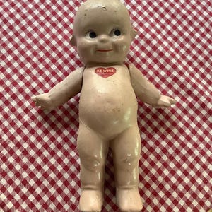 Kewpie - Rosie O’Neil Composition Doll. She does have flaws.
