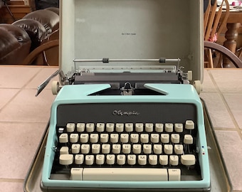 Olympia SM7 Rare Robins Egg Blue No.8 De Luxe Typewriter. Not a expert. The information is what I could find. There is rust in places.
