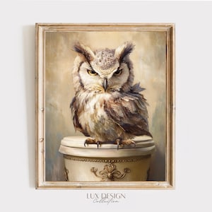 May include: A framed wall art print featuring an owl with brown, white, and gray feathers perched on a decorative cream-colored pedestal with gold filigree details. The owl has intense yellow eyes and is set against a soft, neutral background.